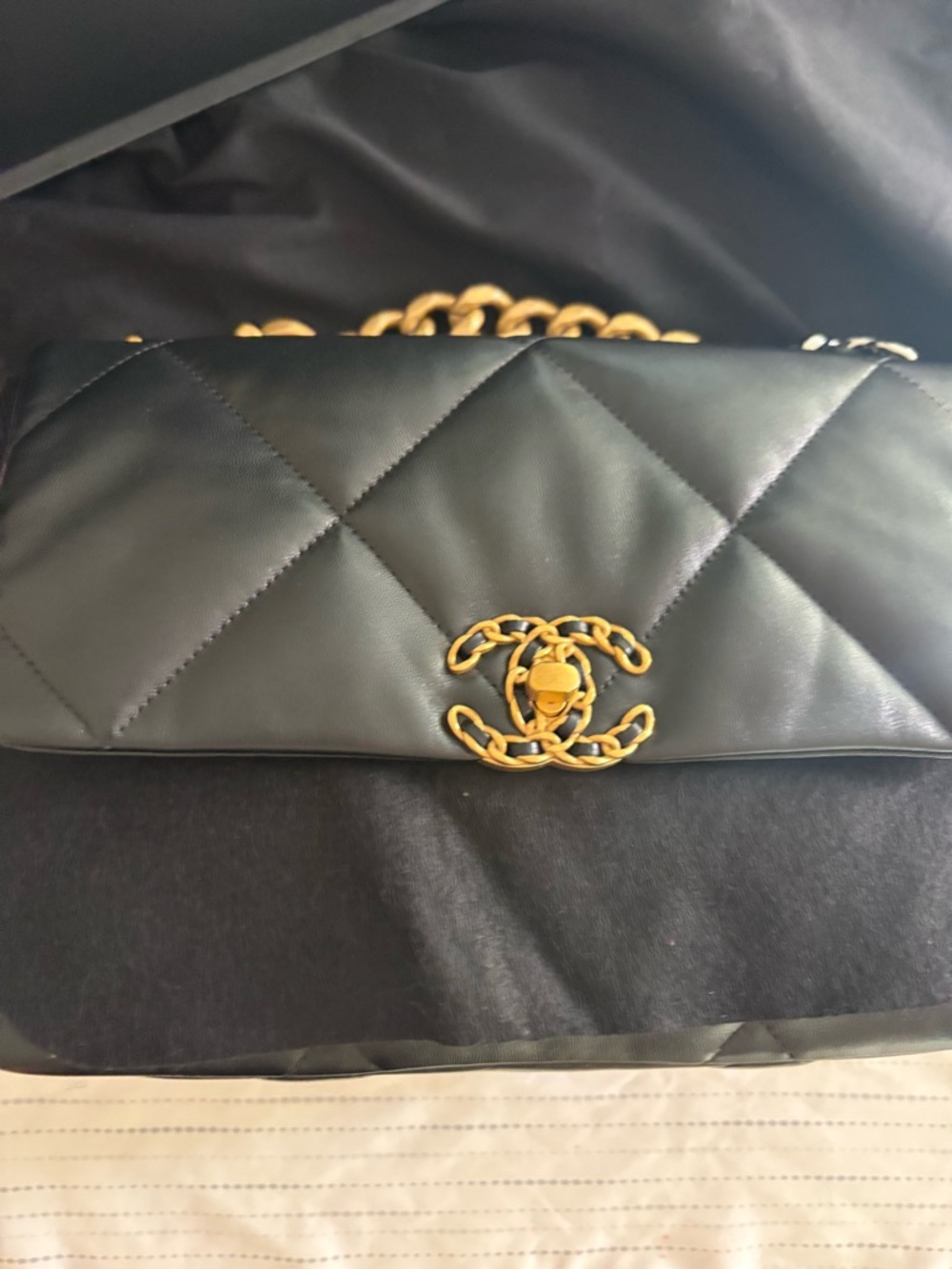 CHANEL Black Quilted Leather Shoulder Bag with Gold Chain CC